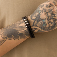 Bracelet en cuir tressé chic haut de gamme, fermoir magnétique, accessoire de poignet tendance