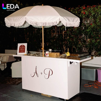 LEDA Nouveau design Chariot à dessert en acrylique blanc Chariot alimentaire mobile avec roues Parasol géant pour la décoration de mariage