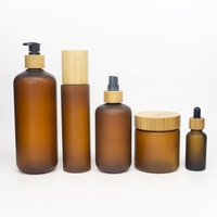Vente en gros de pots en plastique PET transparent ambré givré naturel de 150 ml, 250 ml, 500 ml, nouveau produit, pour beurre corporel, crème cosmétique, avec couvercle en bambou
