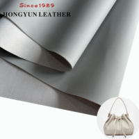 Tissu en similicuir de designer, résistant à l'hydrolyse, tissage uni, matériau PVC imperméable, cuir synthétique PVC pour chaussures et meubles