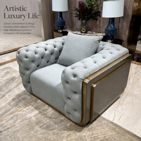Fauteuil Chesterfield moderne de luxe capitonné en tissu avec cadre métallique pour salon de villa