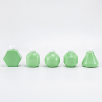 Nouvelle bouteille en verre opale verte conçue de 30ml avec bouchon compte-gouttes pour l'emballage de soins de la peau cosmétiques de luxe