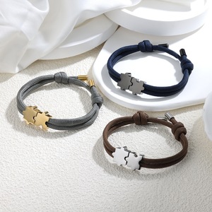 สร้อยข้อมือสแตนเลสสตีลชุบ PVD 18k แบบขายส่ง พร้อมจี้รูปจิ๊กซอว์ สร้อยข้อมือเชือกถักมิลานแบบทำมือสำหรับคู่รัก - Product Image 1