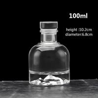 Transparante ronde glazen flesje voor wijn, likeur, brandewijn, sap, drank of fruitwijn met kurk of glazen deksel, 100ml