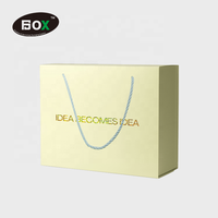 Boîtes de papier de boîte-cadeau d'estampage d'or recyclables de luxe avec ruban pour l'impression en relief de fourrure de vêtements et de chaussettes pour un emballage de qualité supérieure