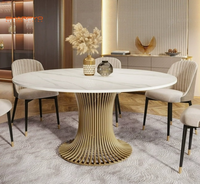 Table à manger ronde de luxe avec plateau en marbre et structure en acier inoxydable brossé doré pour la maison et l'hôtellerie