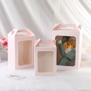 Caja de regalo vacía de lujo personalizada Cajas de embalaje de regalo de flores de papel de arte plegable con asa