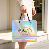 Sacs de vente au détail en papier holographique personnalisés avec logo imprimé, avec poignée en tissu épais pour les magasins de chaussures, de vêtements et de cosmétiques