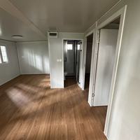 Maison conteneur modulaire préfabriquée extensible à double aile de 20/40 pieds, étanche et isolée, pour le marché australien