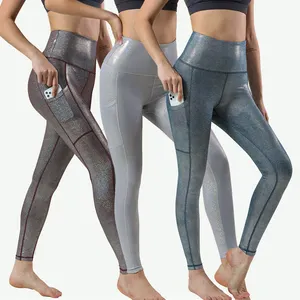 Pantaloni da palestra donna vendita calda Leggings da Yoga lucidi solidi pantaloni sportivi metallici all'ingrosso pronti per la spedizione abbigliamento da palestra