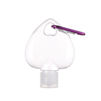 Mini flacon de voyage transparent en forme de cœur avec mousqueton, conteneur vide rechargeable en PET à presser pour désinfectant pour les mains et cosmétiques