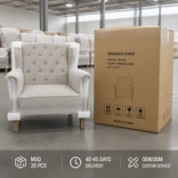 Fauteuil à dossier haut capitonné en lin 100% avec pieds en chêne massif et garniture cloutée, chaise de lecture pour salon, mobilier sur mesure