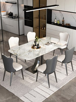 Table à manger luxueuse en pierre frittée carrée avec base incurvée en acier inoxydable bronze, motif marbre moderne et minimaliste, table de cuisine