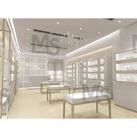Vitrine de bijoux en verre moderne de luxe Comptoir en bois éclairé par LED pour jouet Whisky Curio Cabinets pour magasin Design d'intérieur utilisé