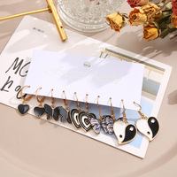 Vente en gros de boucles d'oreilles créatives avec pendentifs en forme de papillon noir, ensemble de boucles d'oreilles Tai Chi en forme de cœur, accessoires pour femmes