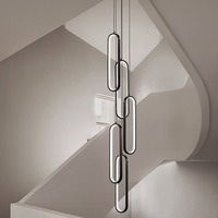 Lustre ovale noir minimaliste simple moderne pour villas en duplex et appartements loft avec long plafond