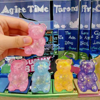 Vente en gros : Ours anti-stress souple scintillant effet aurore, motif vortex, emballé en boîte colorée