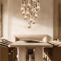 Lustre moderne de luxe en laiton doré, suspension décorative LED en verre en forme de goutte de pluie pour entrée à plafond haut