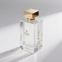 Flacon de parfum rectangulaire en verre rechargeable luxueux de 30 ml, 50 ml, 100 ml, transparent avec bouchon carré doré et vaporisateur à pompe