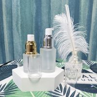 Bouteille d'émulsion en verre dépoli de haute qualité de luxe de couleur jaune rose avec tête de pompe à collier en argent rose pour crème pour le visage