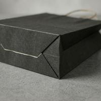 Sacs de shopping en papier kraft noir de qualité supérieure avec poignées torsadées, sacs d'emballage de luxe en papier vierge pour la vente au détail