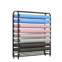 Présentoir à roulettes double face pour rouleaux de tissu, tapis, nappes et cuir