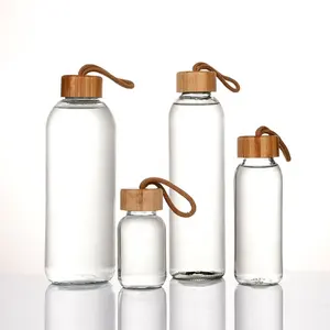 500ml 750ml Wholesale Custom Logo Borosilicate Glass Portable Mineral Eco-friendly Water Bottle With Top Bamboo Lid For Sports