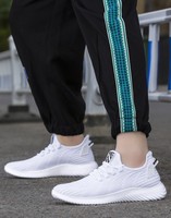 Chaussures de sport pour hommes en gros, mode, toutes saisons, tricotées, décontractées, à lacets, respirantes, doublure en coton, antidérapantes