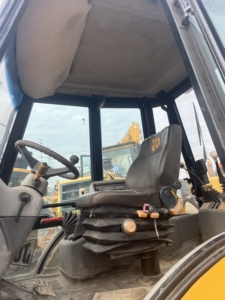 รถตักล้อยาง JCB รุ่น 4CX สีเหลือง มือสอง อุปกรณ์ก่อสร้าง น้ำหนักบรรทุก 9 ตัน เครื่องยนต์คัมมินส์ - Product Image 6
