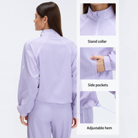 Veste coupe-vent respirante à col montant pour femme Ourlet réglable Vêtement de sport pour le vélo, la course à pied et le yoga Haut zippé avec poches