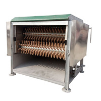 Machine d'abattage et de plumeage de poulets et de canards d'une capacité inférieure à 600 volailles par heure