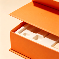 Flip magnétique personnalisé  Coffret cadeau cosmétique haut de gamme en carton rigide orange avec pré-remplissage  Insert en mousse EVA découpé sur mesure pour emballage de kit de soins de la peau OEM ODM