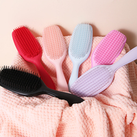 Échantillon gratuit OEM Brosse à cheveux démêlante Cheveux secs humides Élimine les nœuds Réduit la casse Brosse à cheveux démêlante pour tous les types de cheveux