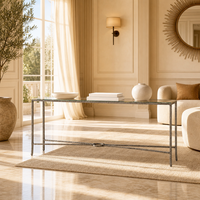 Table console élégante et luxueuse en métal massif moulé à la main avec plateau en verre en forme de X pour villa, hôtel, salon