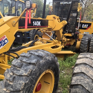 รถเกรดเดอร์ Caterpillar 140K มือสอง สีเหลือง อุปกรณ์ก่อสร้างสำหรับงานหนัก - Product Image 1