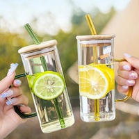 Vente en gros de gobelets à eau carrés en verre résistant aux hautes températures pour la maison, avec poignée, couvercles en bambou et paille