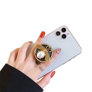 X920 Manufacturer Direct Good Quality Metal Soft Hard Enamel <b>Popping</b> <b>Phone</b> Grip Custom Logo Griptok <b>Phone</b> <b>Holder</b> Stand - Product Image 1