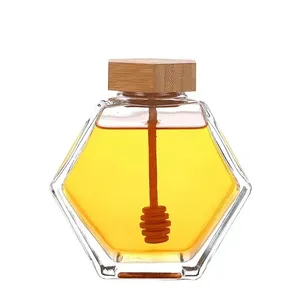 Tarro de miel de vidrio Hexagonal transparente de grado alimenticio, 100ml, 220ml, 380Ml, botella de almacenamiento de miel Natural con cubierta de bambú y varilla agitadora