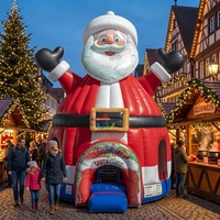 Château gonflable dôme robuste avec thème bonhomme de neige en chapeau noir pour la location d'événements de Noël, de festivals et de carnavals