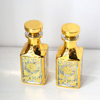 Flacons d'affichage de parfum de décantation fantaisie personnalisés de 150ml carafe d'huile de parfum en or