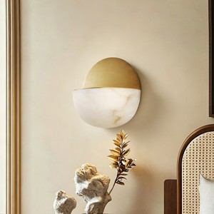 Circular brass <b>LED</b> wall lamp with white plaster finish and warm white <b>light</b>—suitable for indoor living <b>rooms</b> bedrooms and home - Product Image 1