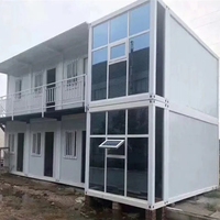 Bâtiment modulaire préfabriqué multi-étages en conteneurs, structure en acier robuste, solutions de bureaux et d'appartements, résistant au vent