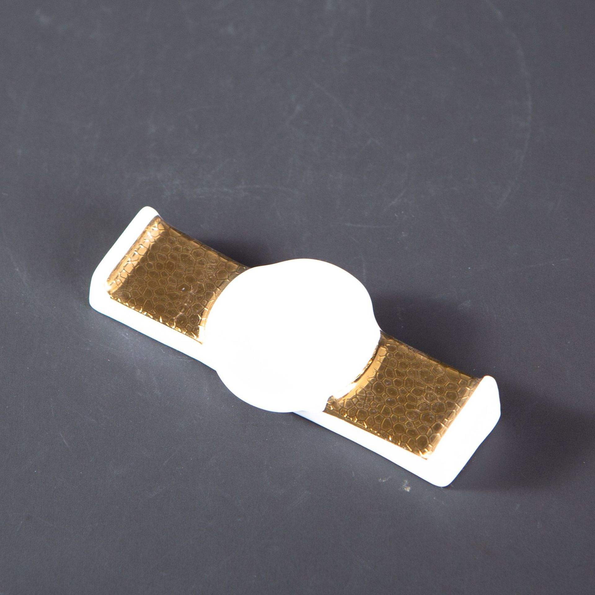 Gold chopstick holder