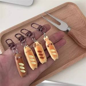 CHENXI Porte-clés en résine Lapin Ours Baguette, Pendentif Mignon Dessin Animé en Forme de Pain, Breloque de Sac, Cadeau pour Couples et Amis - Product Image 1