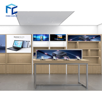 Mobilier pour atelier de réparation d'ordinateurs Moderne-computer-shop-interior-design Comptoir en bois Vitrine murale pour décoration de magasin de téléphonie