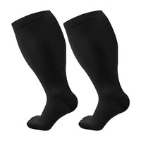 Vente en gros directe d'usine Meilleures ventes Chaussettes haute compression au genou grande taille multicolores solides pour l'hiver Techniques de tricot