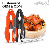 Ensemble professionnel de 4 outils pour fruits de mer avec manche en ABS, comprenant un casse-crabe en acier inoxydable, une fourchette à crabe, une cuillère à fruits de mer et une aiguille.
