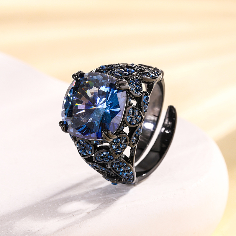 Anillo abierto negro dorado con corte de nido de pájaro, blanco y azul chapado.