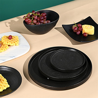 Assiettes en céramique mate en porcelaine noire en gros, service de vaisselle en grès, assiette à dîner et assiette à dessert à glaçure à pois rétractés