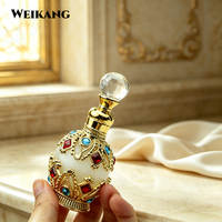 Nouveau produit : Flacon de parfum arabe 10 ml, exquis, avec filigrane doré et bijoux, et applicateur en verre.